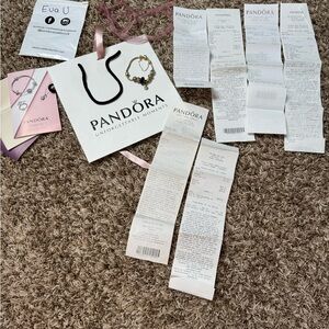 14k Gold Pandora bracelet with gold charms